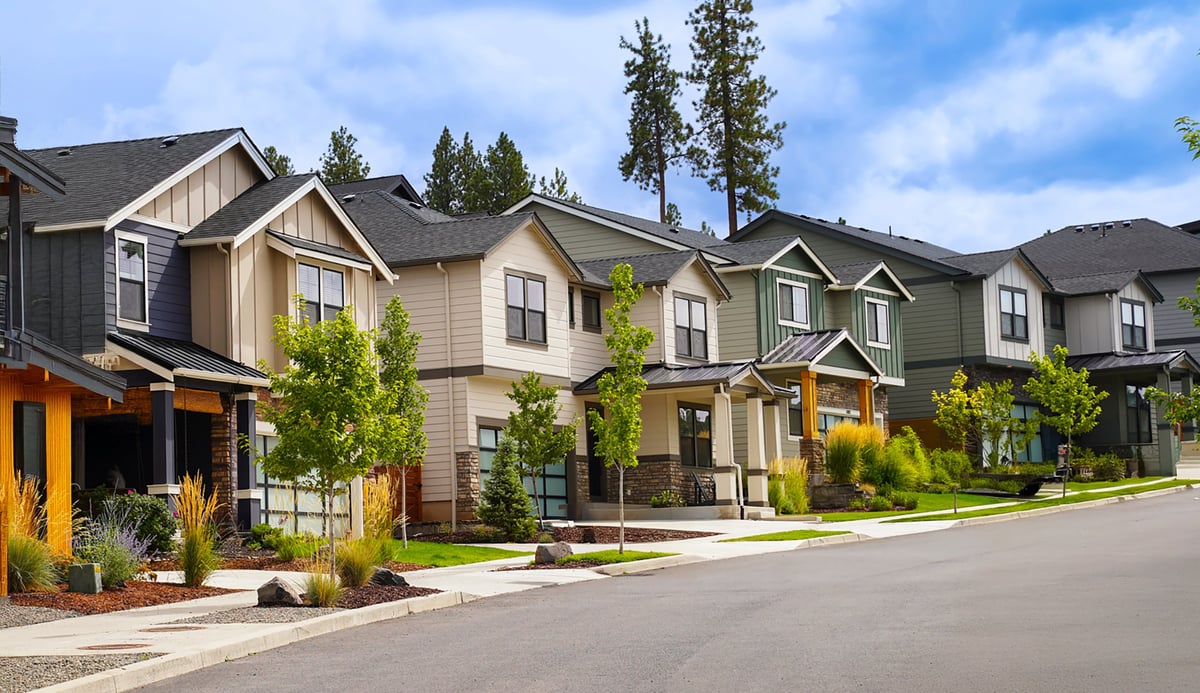A quiet residential neighborhood under a clear blue sky